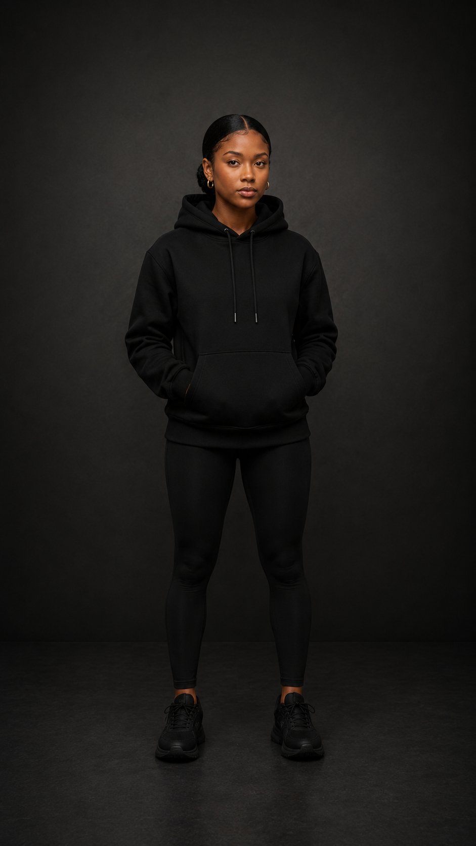 Kim wearing The Conquer Hoodie